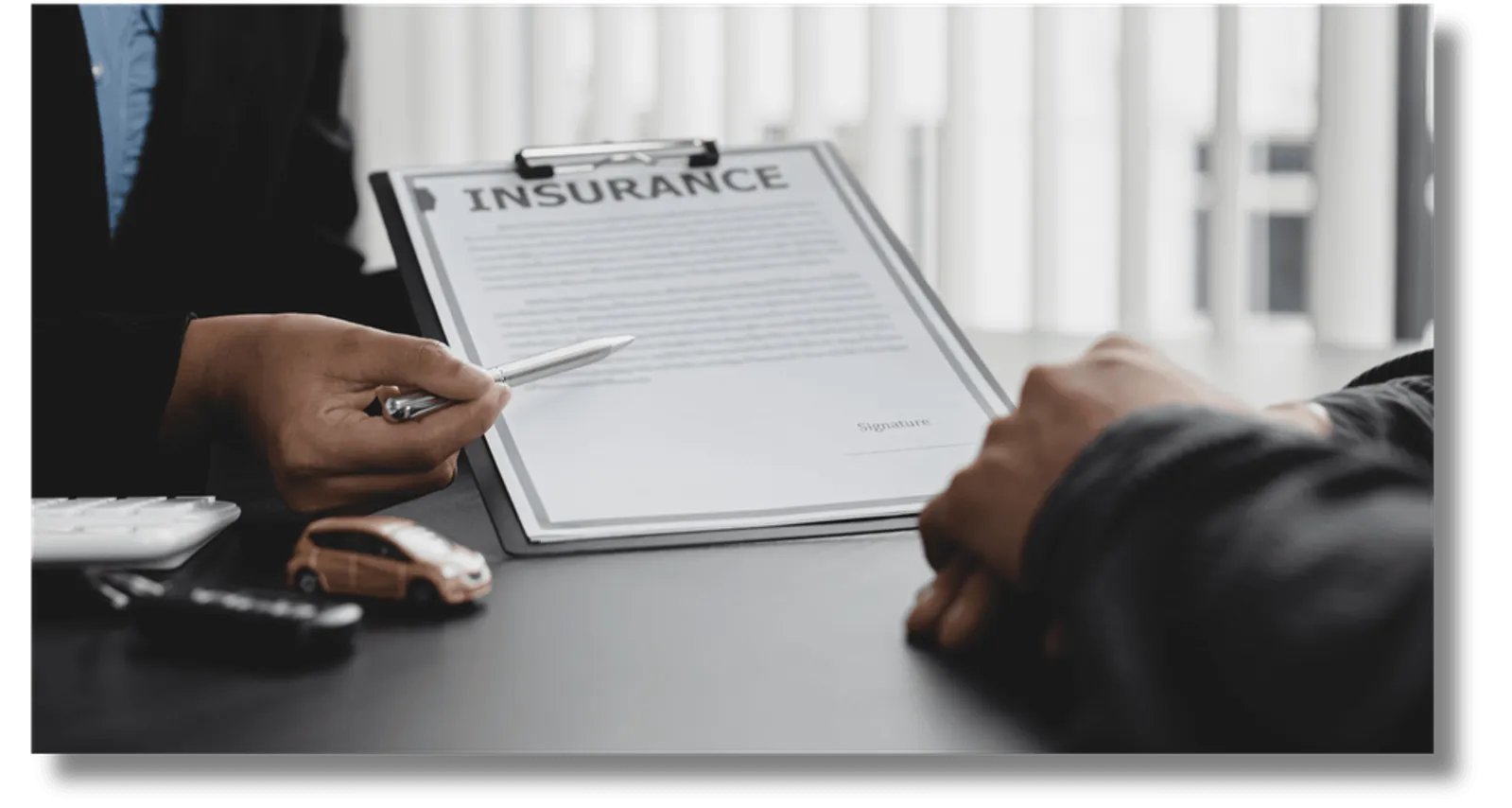 Photo of a two people reviewing documents